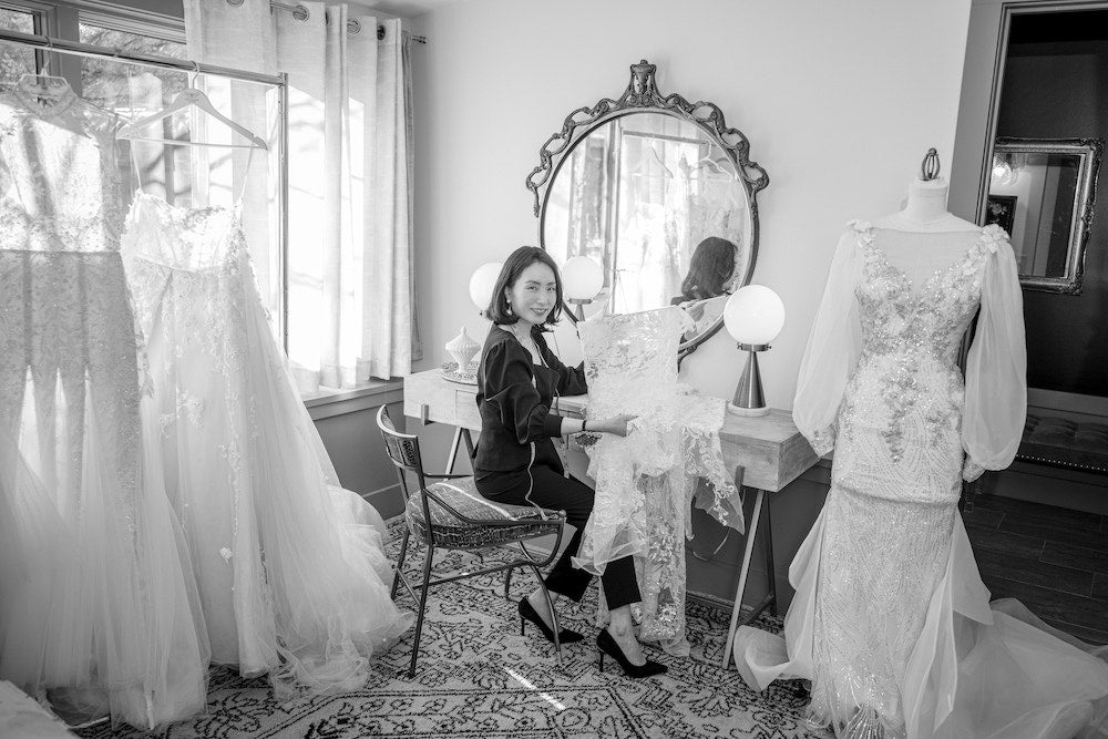 angela showing a beautiful lace sample in her atelier