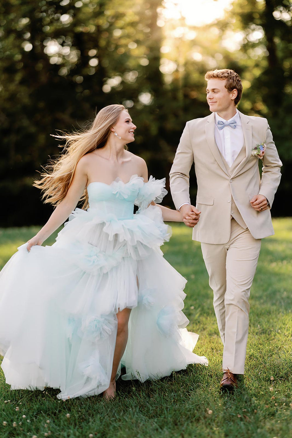 Full view of the Belle sky-blue tiered tulle A-line wedding gown showing the dreamy layered skirt silhouette