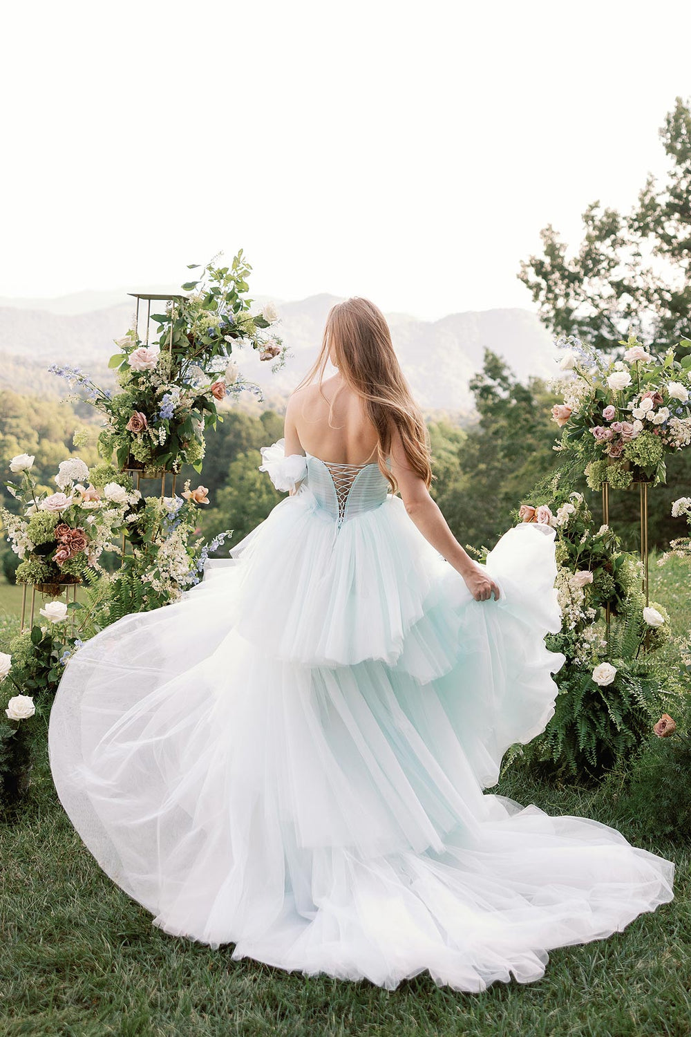 Back view of the Belle wedding dress featuring the lace-up corset back detail on the structured boned bodice