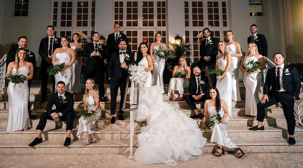 Group photo of wedding party where the bride is wearing Cheasle wedding dress by Angela Kim Couture