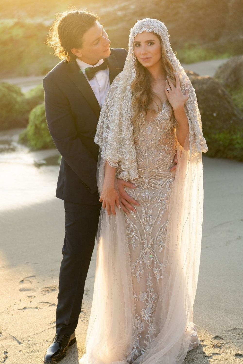 Side profile of bride wearing the Gigi sculptural lace veil with intricate beaded embellishments