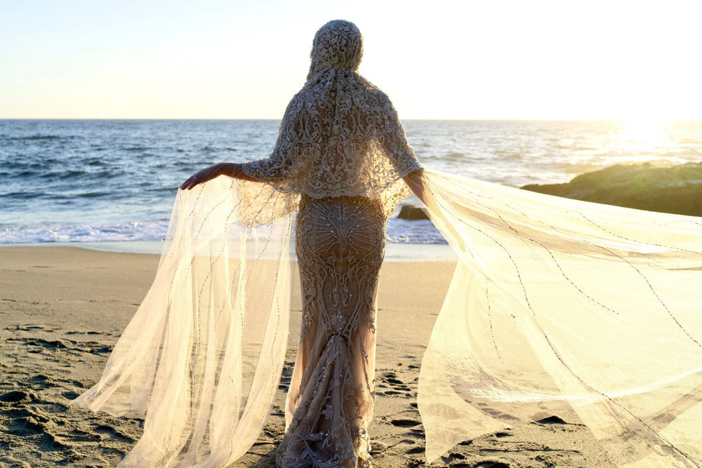 Close-up detail of the intricate hand-beaded lace embellishments on the Gigi couture bridal veil