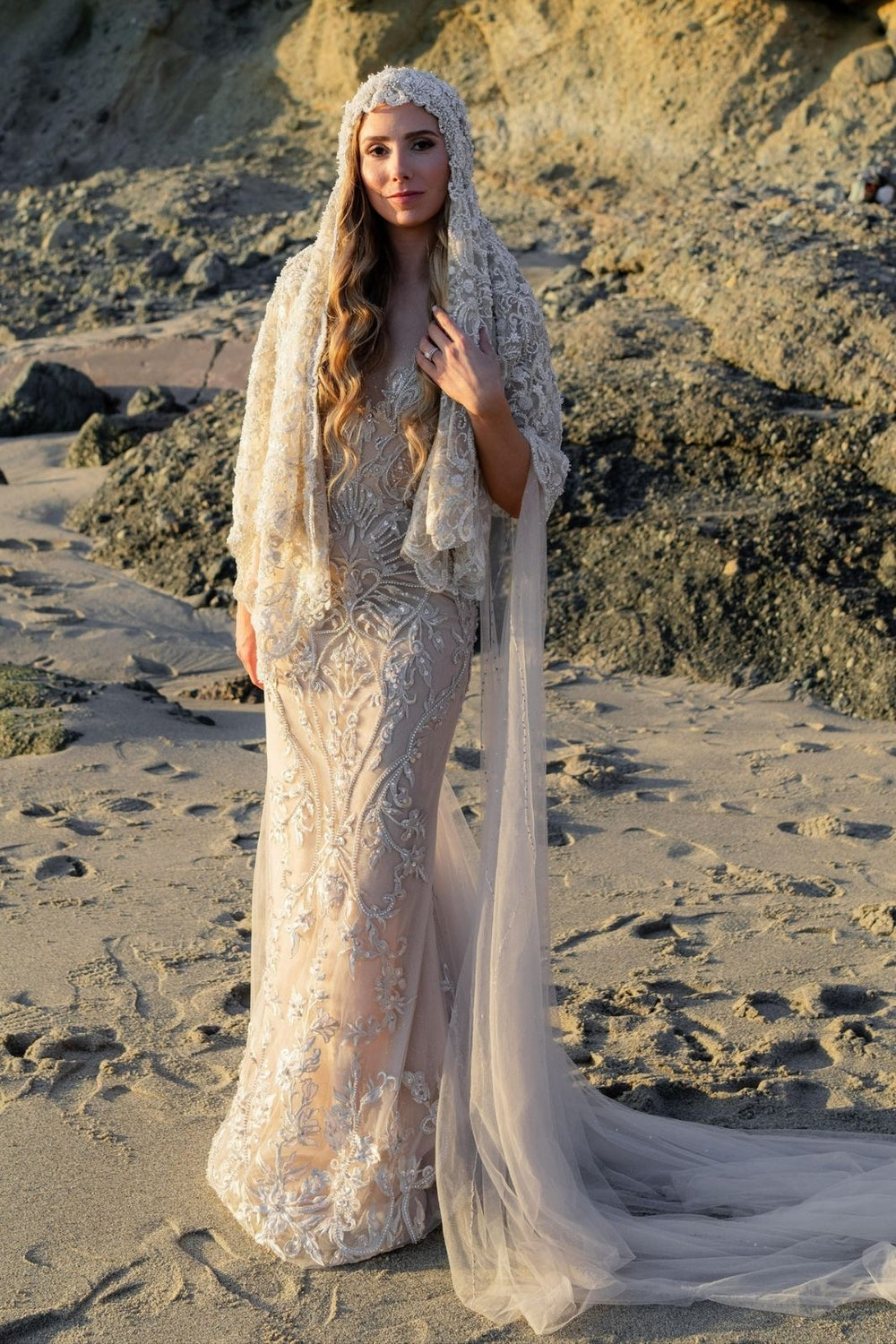 The Gigi hand-beaded lace bridal veil captured in motion, showing its length and ethereal movement