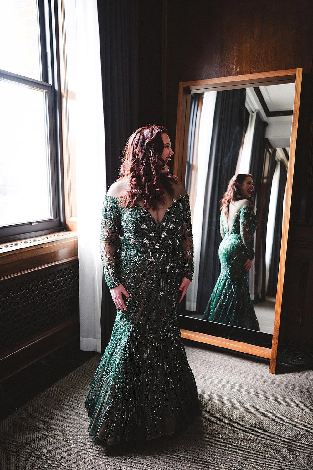 ride wearing the Jessica forest green hand-beaded wedding gown by Angela Kim Couture with off-shoulder illusion neckline and fitted long sleeves