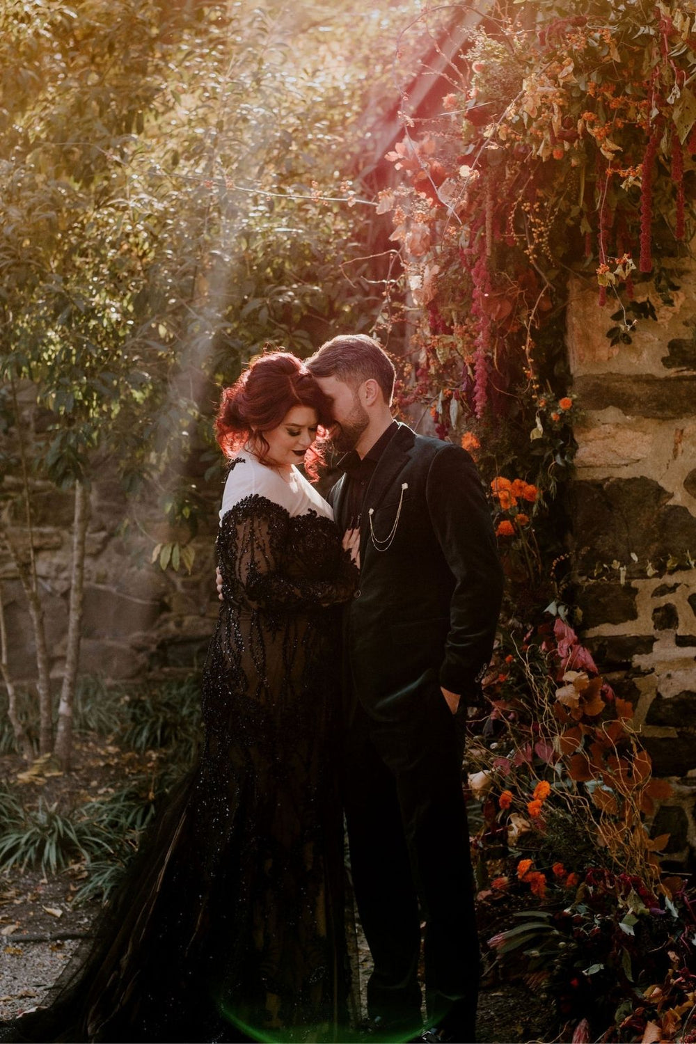 bride wearing the Kati deep plunging black lace gothic wedding gown by Angela Kim Couture