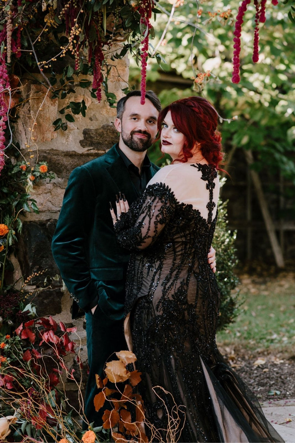 the scoop back illusion tulle of the Kati black lace wedding gown by Angela Kim Couture clearly displayed. 