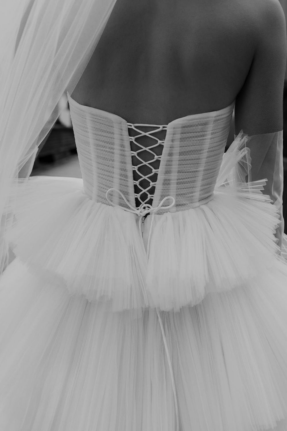 Close-up of the ruching detail on the sheer bustier top of the Rachel couture wedding dress