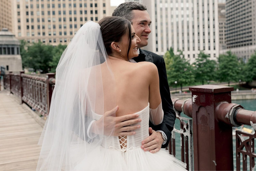 Back view of the Rachel wedding dress showing the lace-up back with tiny loops and strings detail