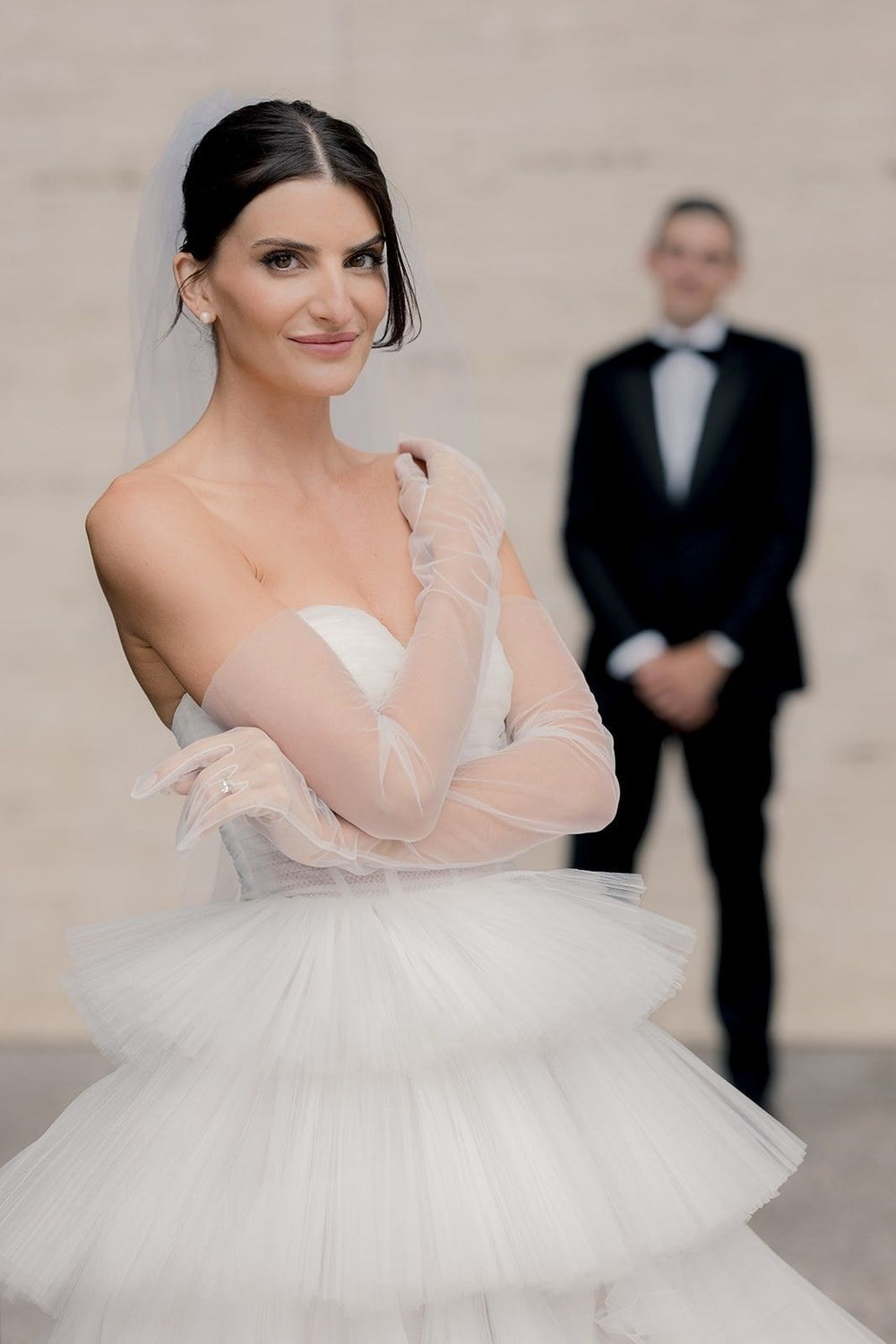 Elegant bridal portrait of bride in the Rachel modern sophisticated tulle gown with strapless bustier