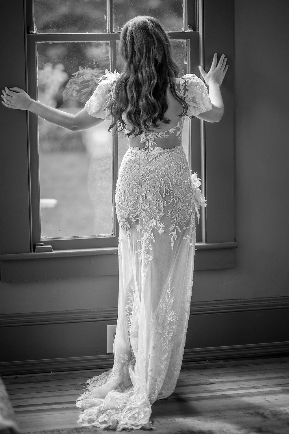 Full bridal look of the Rhea couture wedding dress by Angela Kim Couture featuring illusion bodice, puff sleeves and floral corsage