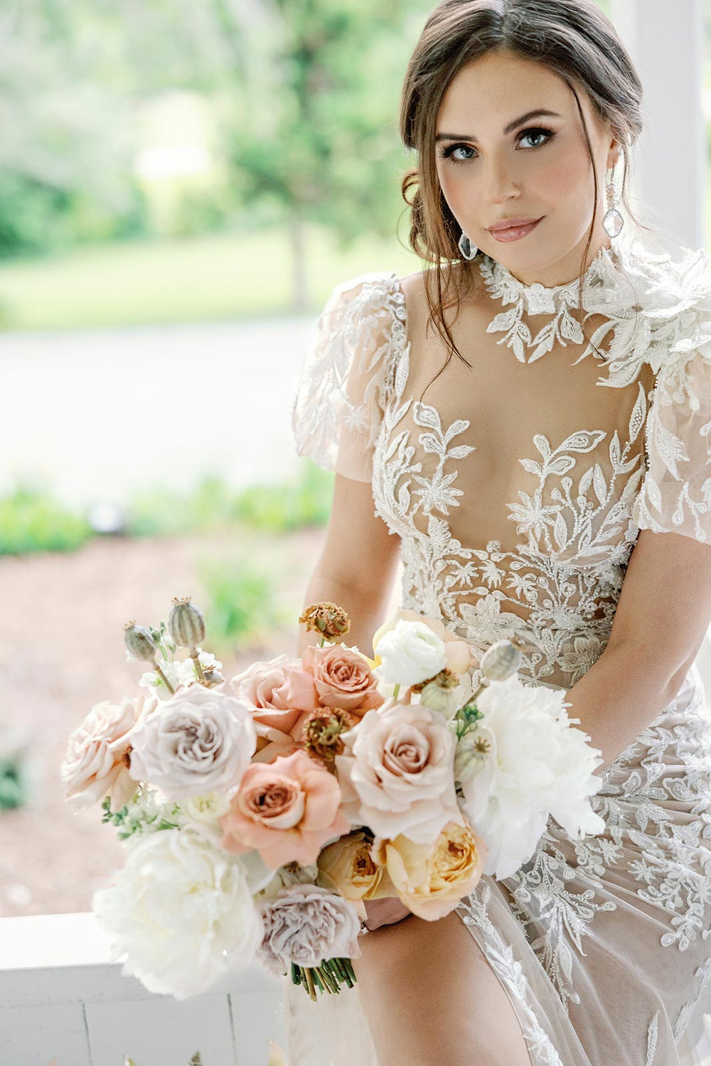 Close-up of the delicate lace and beading embellishments on the illusion bodice of the Rhea couture wedding dress