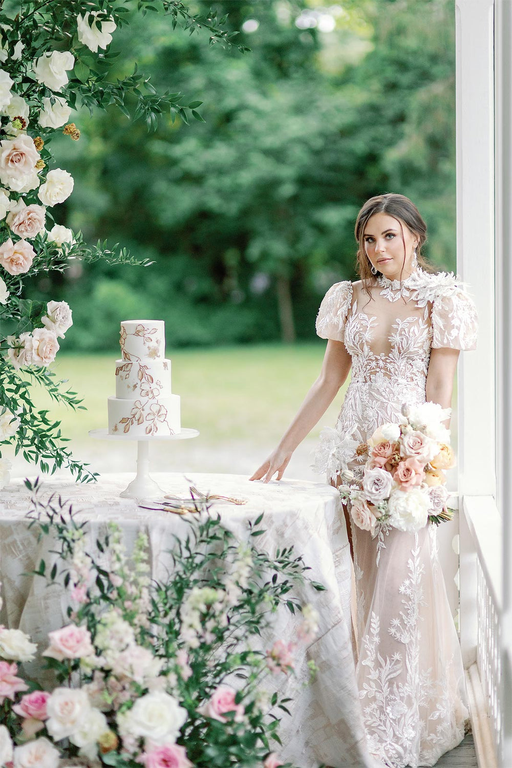 Full bridal look of the Rhea wedding dress with illusion lace bodice, beading, puff sleeves and flower corsage details