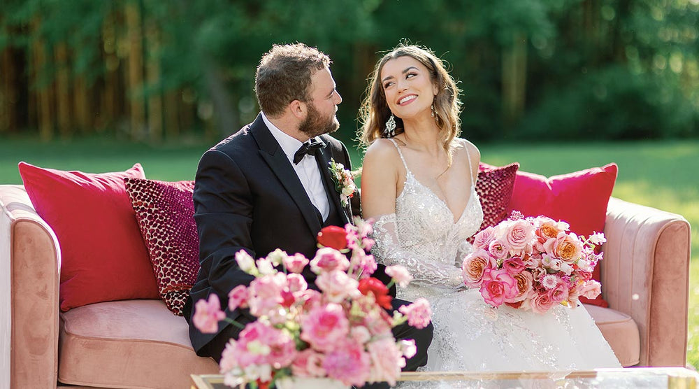 Bride sitting in the Rosalie beaded couture mermaid gown the elegant silhouette