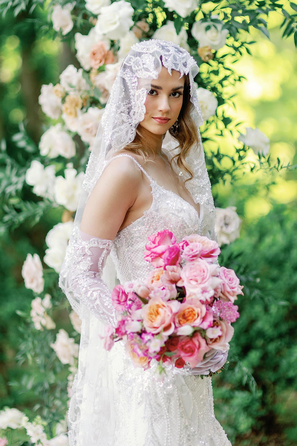 Romantic bridal portrait of bride in the Rosalie couture mermaid wedding dress with glamorous beading and matching veil