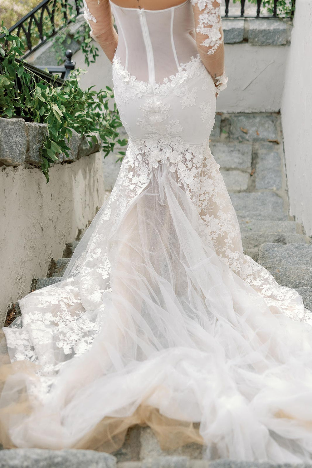 Cathedral train of the Vera lace and sparkly tulle wedding dress spread elegantly on the floor