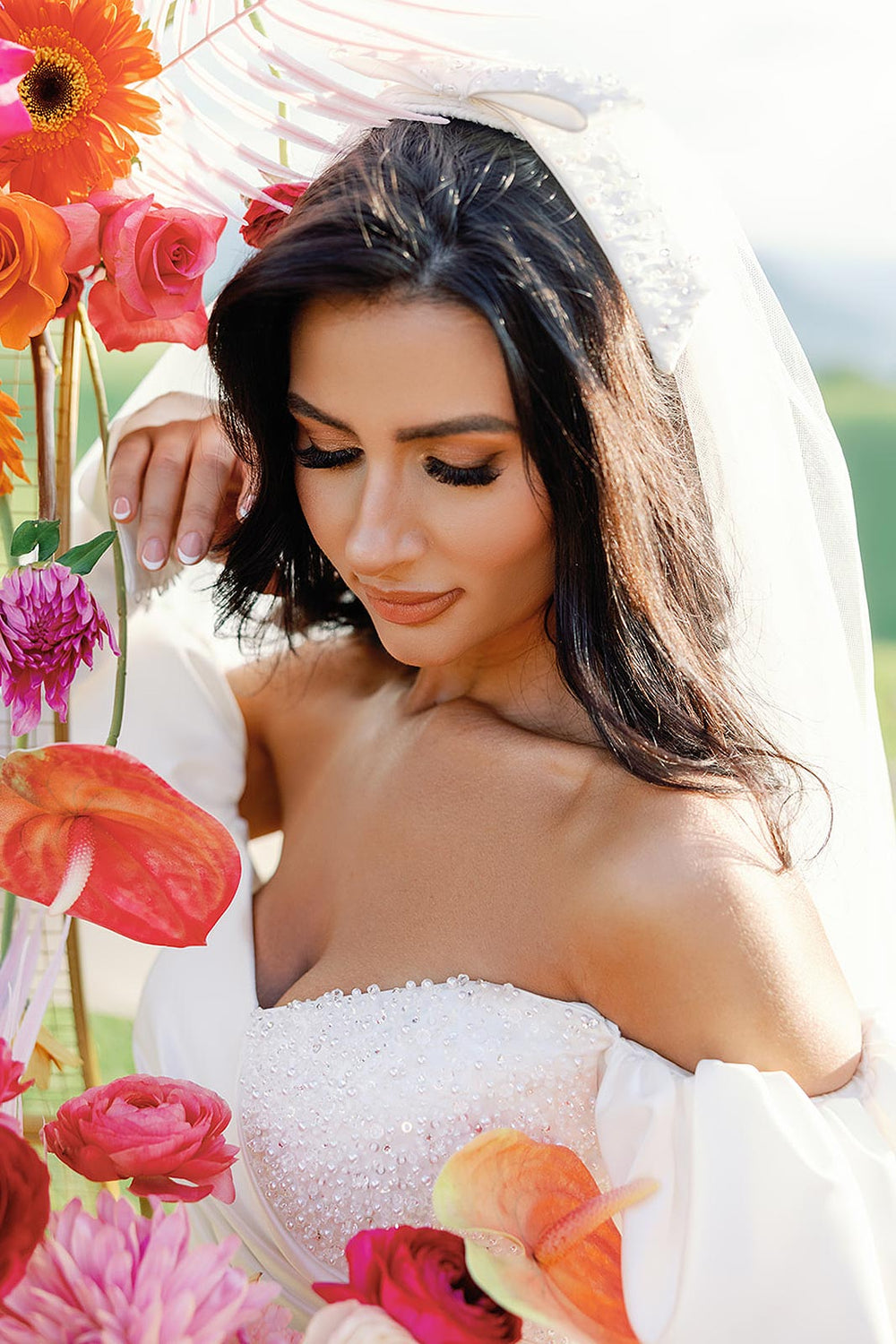 close-up of the crystal, pearl, and sequin hand beading covering the ruched sweetheart bodice of the Veronica short wedding dress by Angela Kim Couture