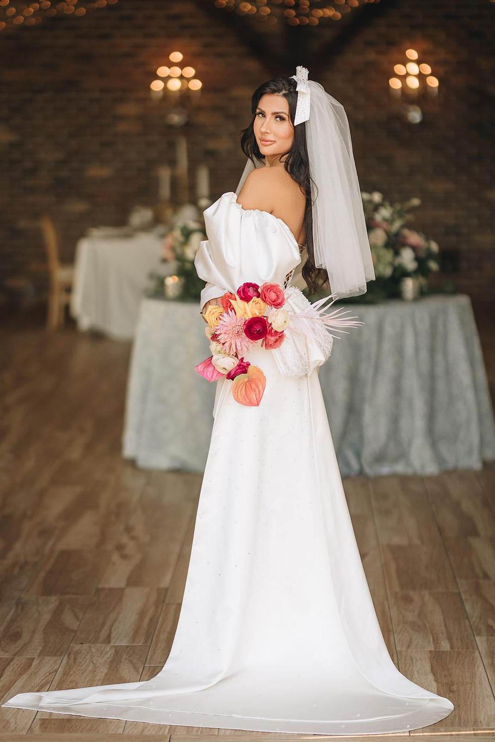 Veronica mini wedding dress by Angela Kim Couture, Juliet sleeves and crystal-beaded ruched bodice, and a detachable train