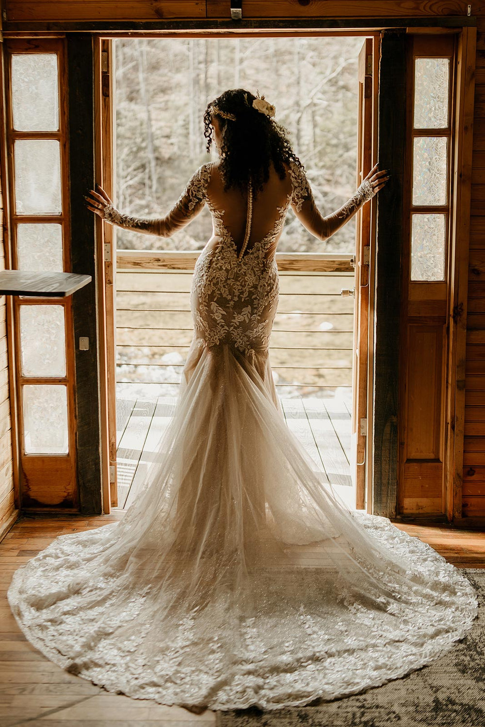 Back view of the Yume cutout mermaid wedding dress by Angela Kim Couture showing the sheer power mesh lining and cathedral train