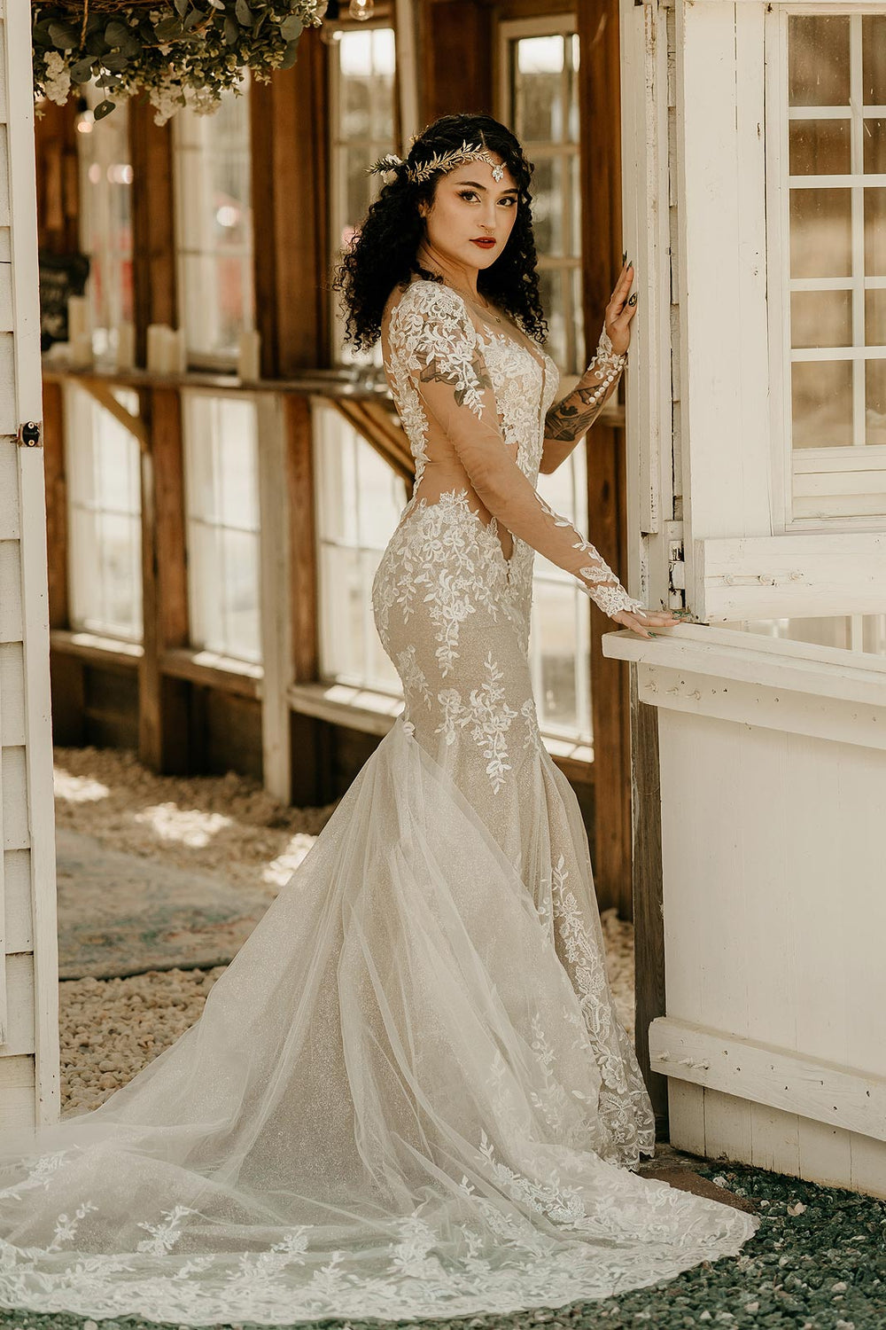 Full-length view of the Yume custom bridal gown by Angela Kim Couture featuring the plunging neckline and mermaid silhouette