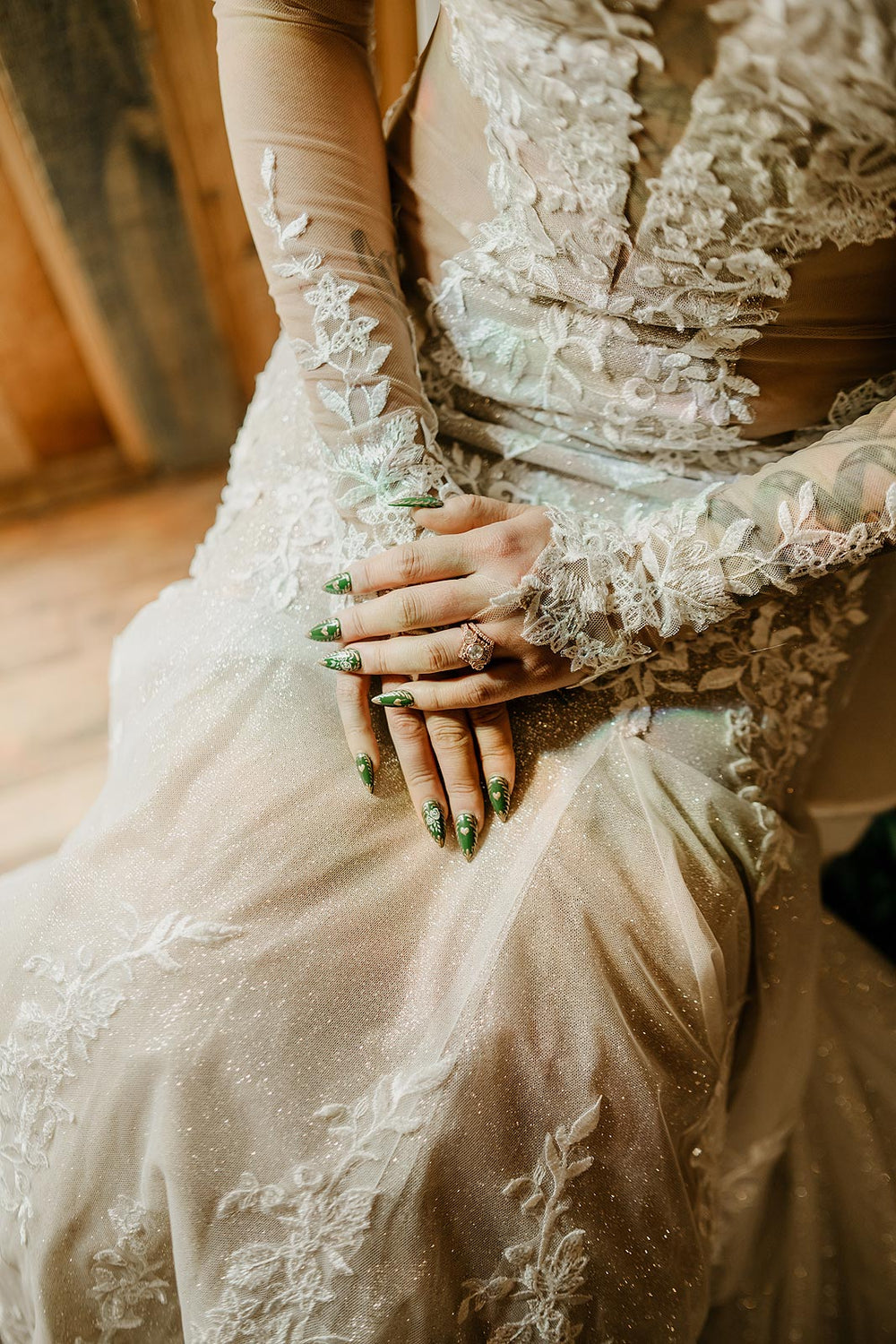 Close-up detail of the Yume wedding dress by Angela Kim Couture highlighting the delicate lace embellishment on sleeves