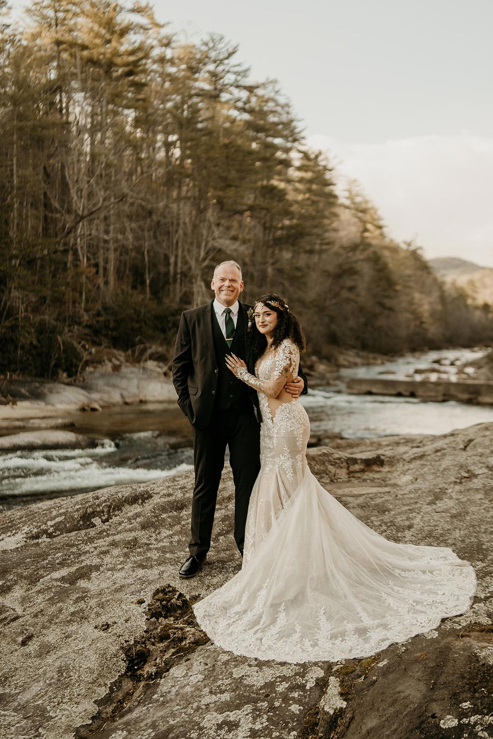 Outdoor wedding portrait of bride in the Yume mermaid dress by Angela Kim Couture with the cathedral train fanned out