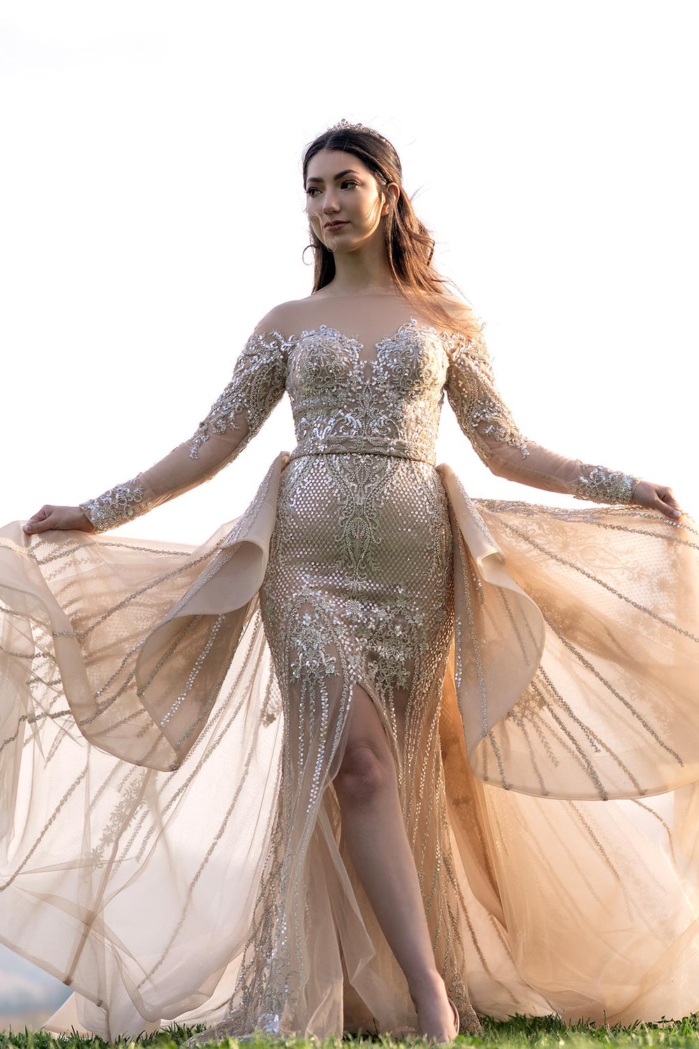 Cathedral train of the Evelina gold couture wedding dress spread dramatically on the floor
