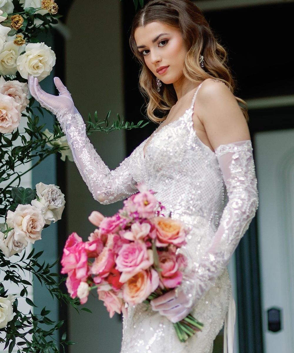 Custom mermaid wedding dress designed by Angela Kim Couture with elegant fitted opera gloves and luxurious fabric crafted to the bride's exact measurements