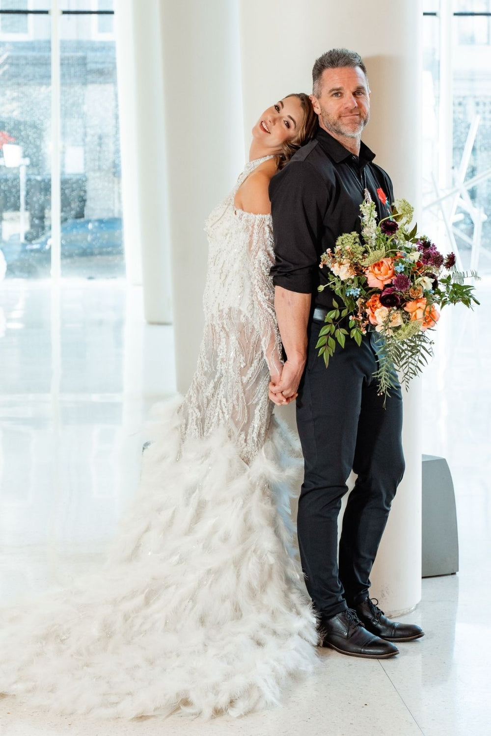 Side profile view of the Ayla mermaid couture wedding dress highlighting the sculpted silhouette