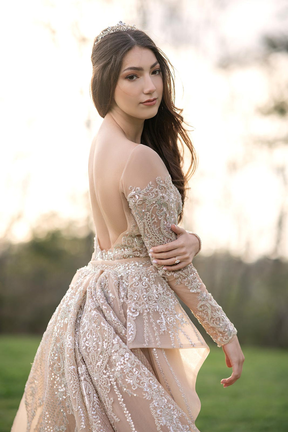Back view of the Evelina couture wedding dress showing the elegant bare back and illusion lace detail