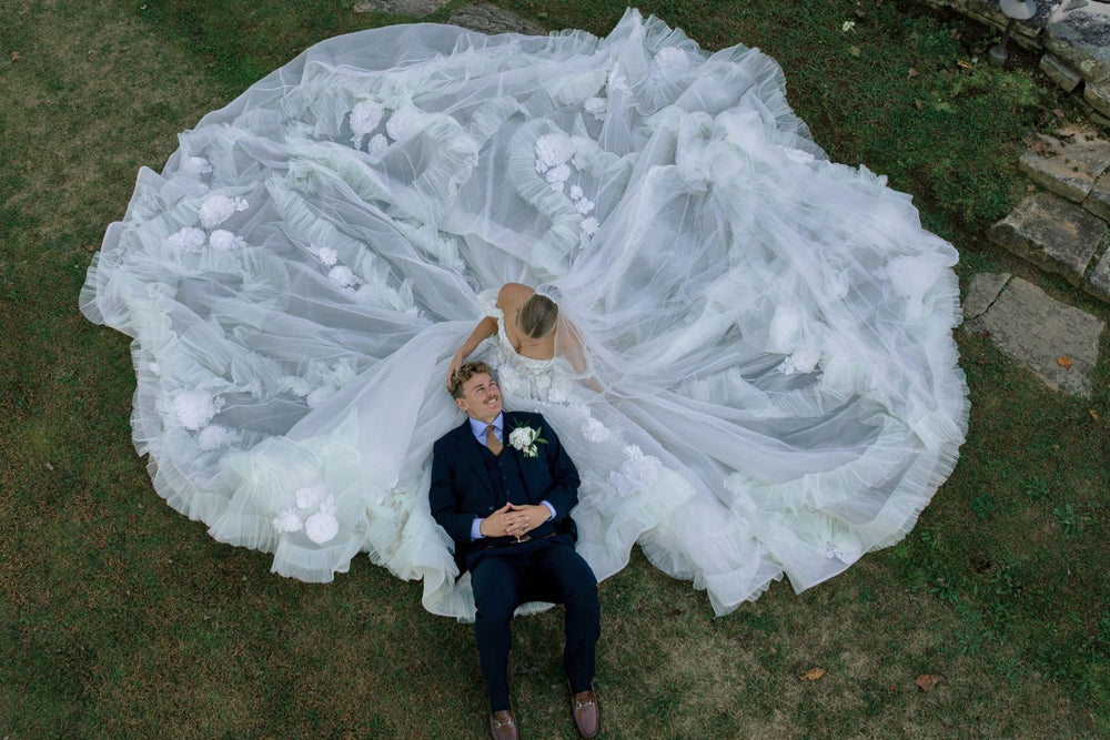 Dramatic sweep of the cathedral-length train on the Allure wedding dress in motion