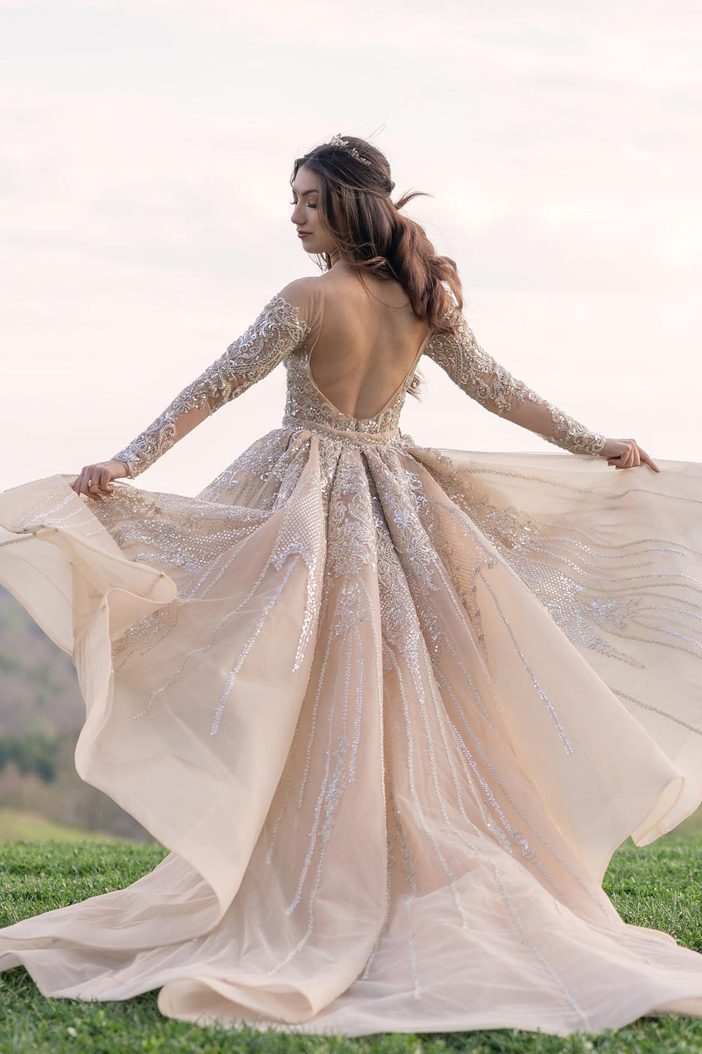 Train detail of the Evelina golden couture wedding dress with beaded hem and sweeping length
