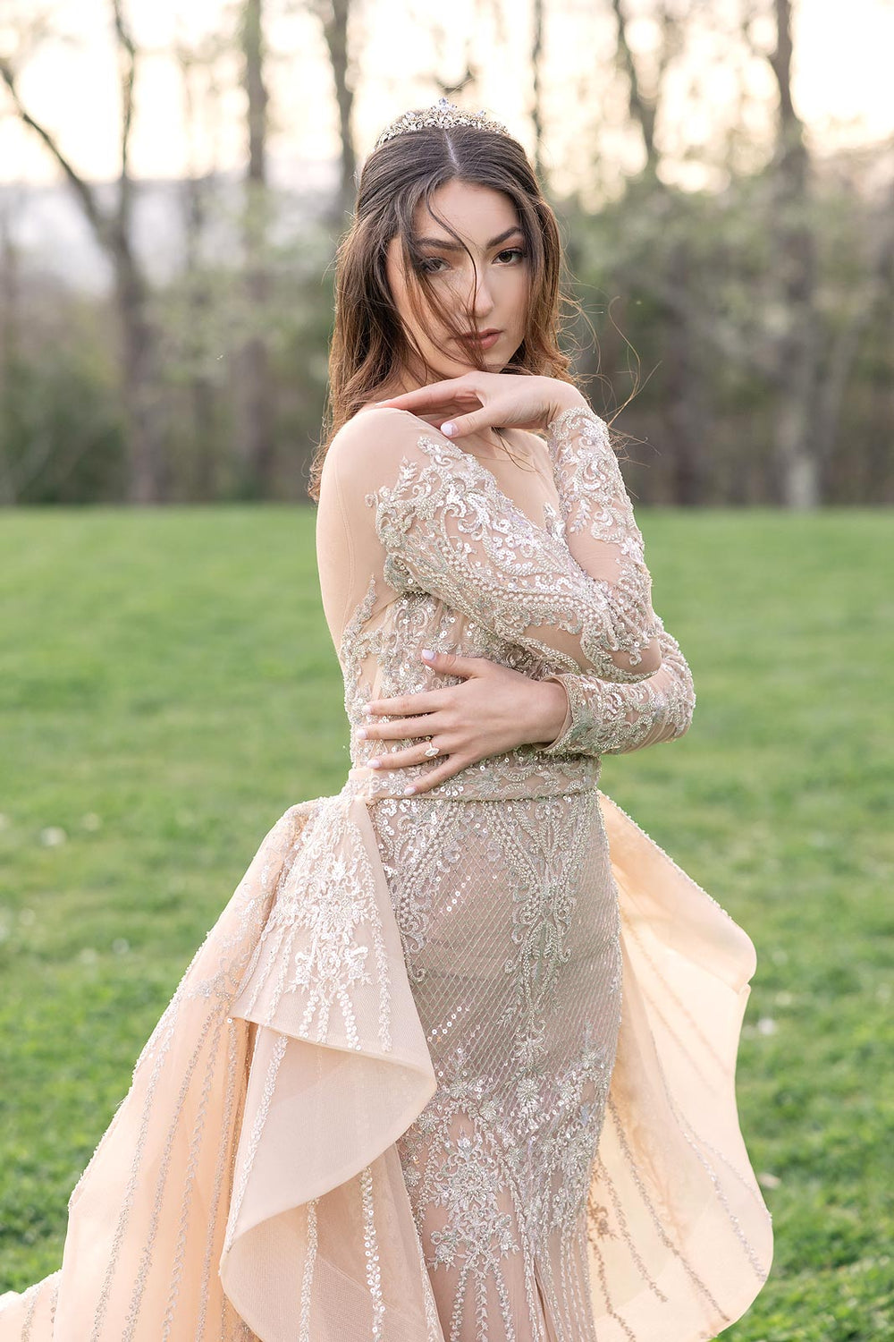 Close-up of the Evelina illusion lace long sleeves with delicate beaded embellishment