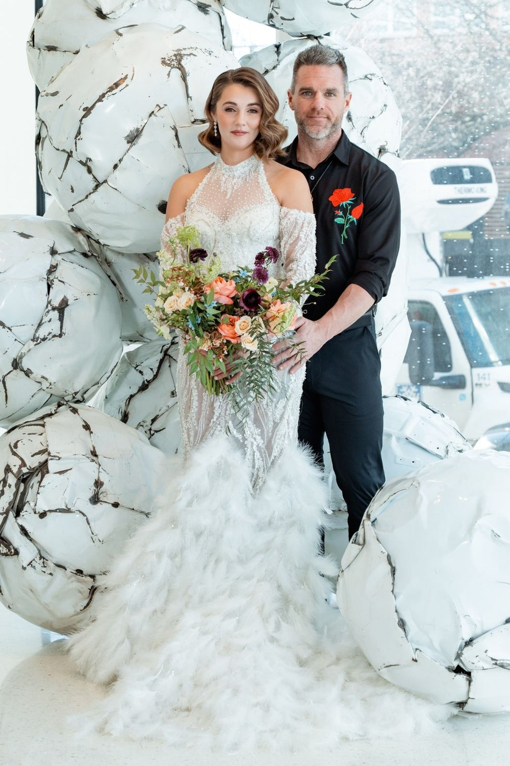 detail of the detachable feather train on the Ayla couture wedding dress