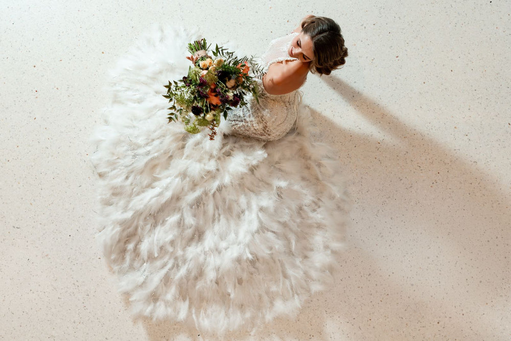 Ayla couture wedding dress with a dramatic detachable feather train by Angela Kim Couture