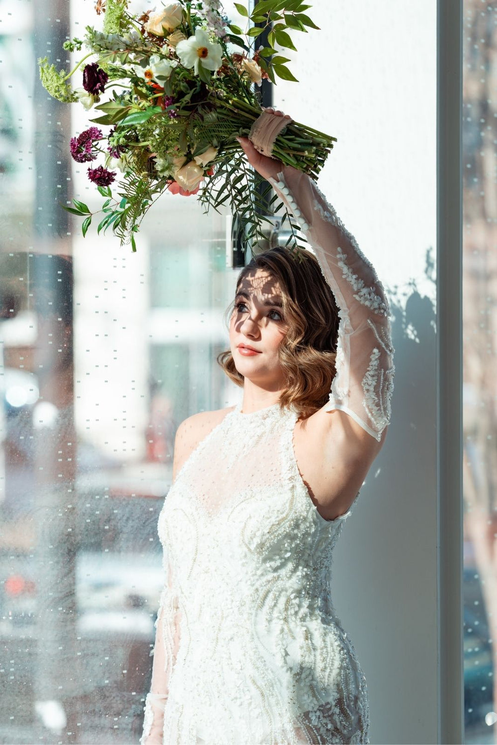 Close-up of the detachable sleeve on the Ayla custom couture wedding dress