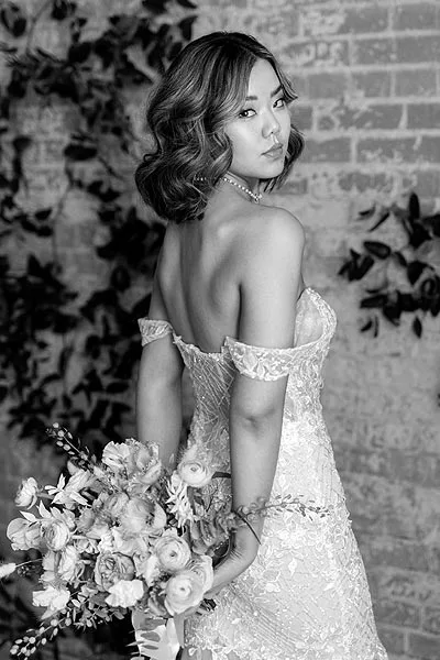 Hannah wearing her custom petite wedding dress from Angela Kim Couture