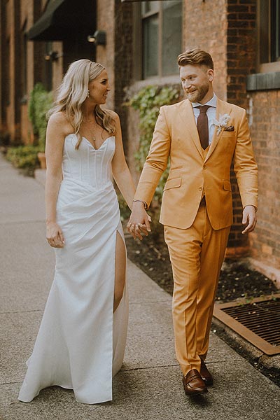 Elizabeth and Jacob walking at their wedding venue.