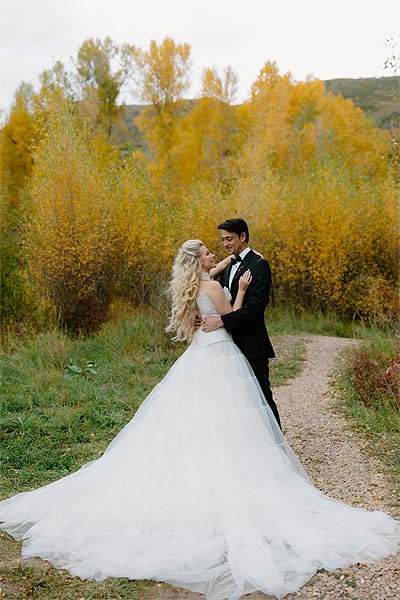 Kaitlin and William posing for a wedding photo.
