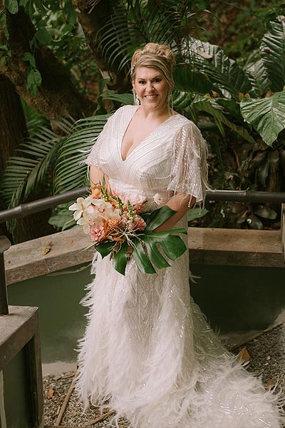 Leah posing in her custom wedding gown.