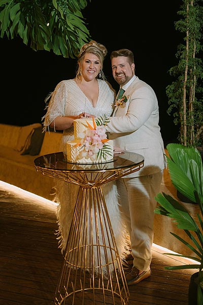 Leah and Buddy cutting their wedding cake.