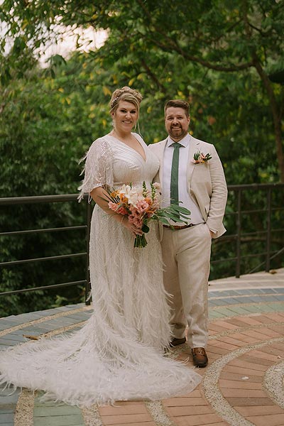 Leah and Buddy posing for wedding photos.