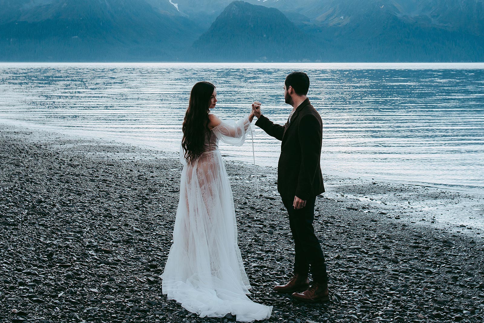 Caroline wearing her sexy boho wedding dress at the shoreline