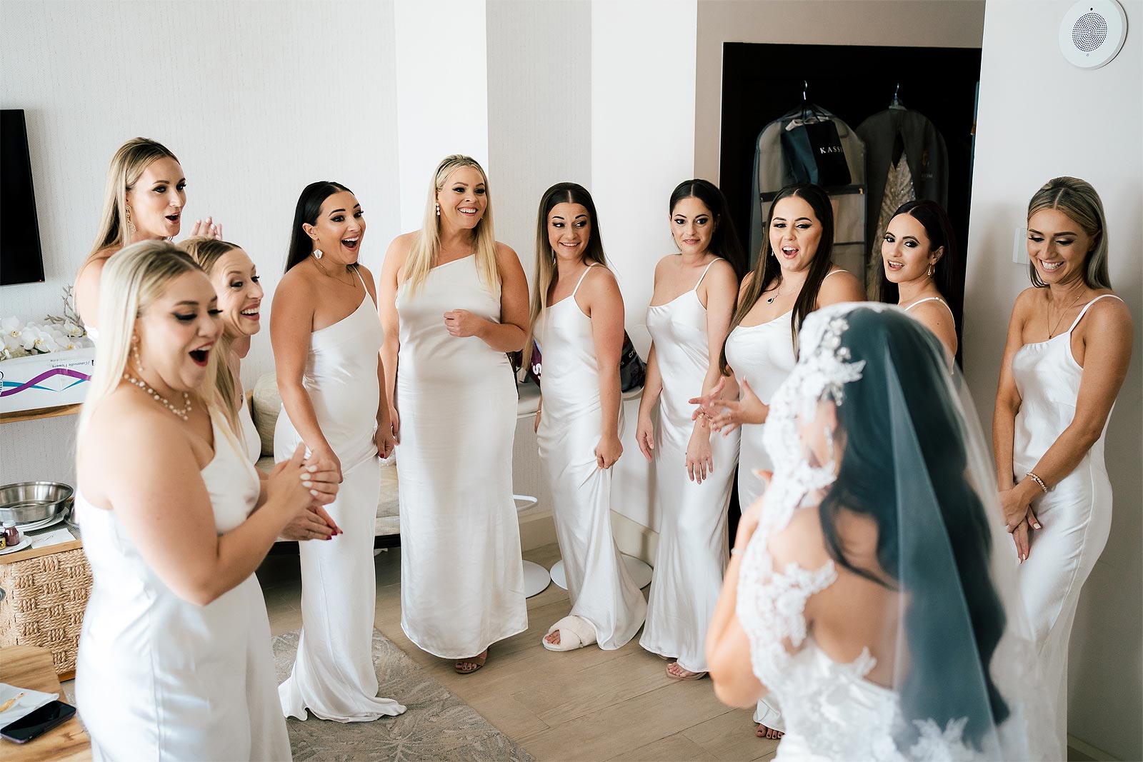 Bridesmaids seeing Chelsea in her wedding dress