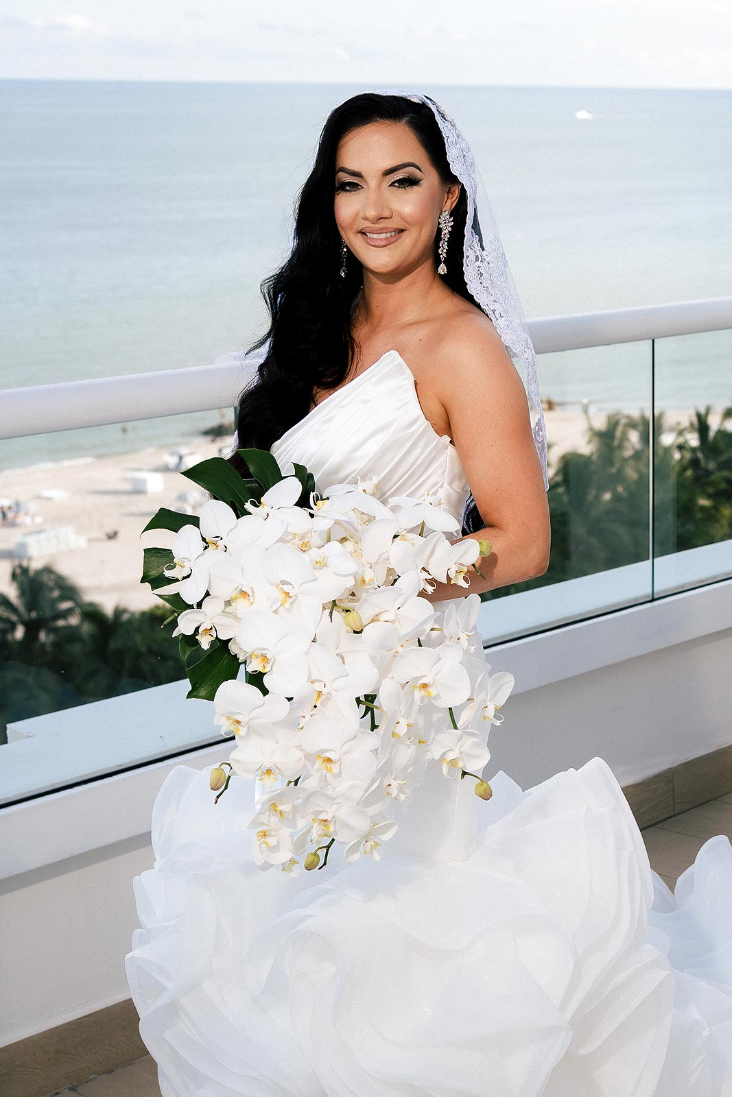 Chesea in her custom wedding dress with bouquet
