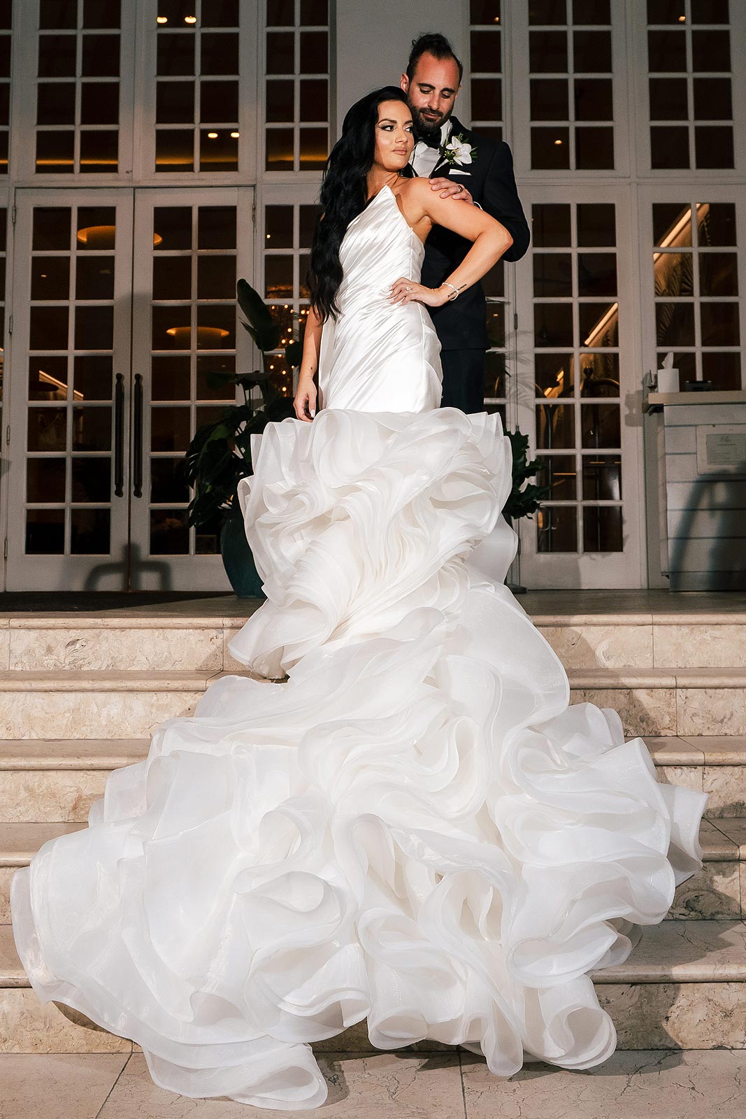 Chelsea posing in her custom wedding gown