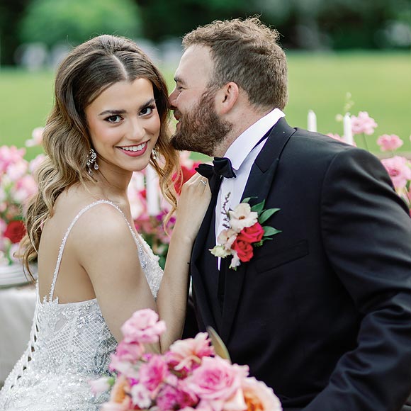 Kyra in her custom wedding dress with her groom
